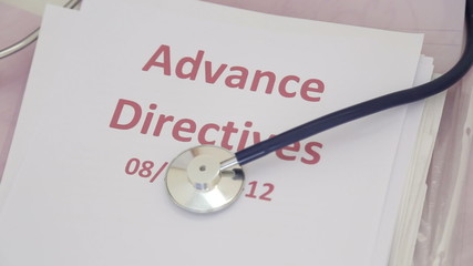 Doctor holding advance directives documentation