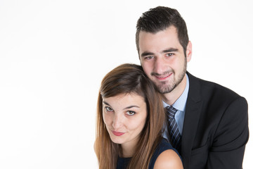 Cheerful young couple standing on white background, isolated with copy space