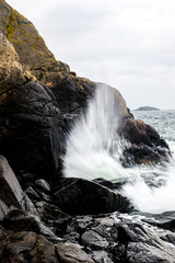 Waves crush against sea cliff in the archipelago