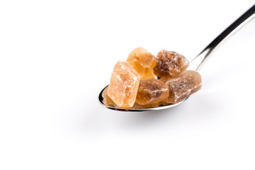 brown caramelized sugar in a wooden spoon