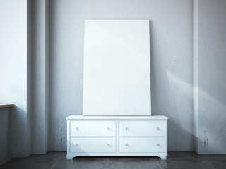 Blank canvas on the chest of drawers in loft.