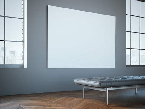 Big white canvas in the gallery with leather chaise-longue.