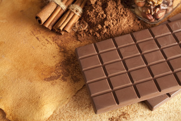 Chocolate bars, cinnamon sticks, cocoa and nuts