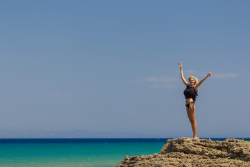 Beautiful slender blonde at the sea