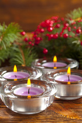 Candles and branch of christmas tree