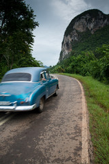 Old american car drive in Cuba rural village