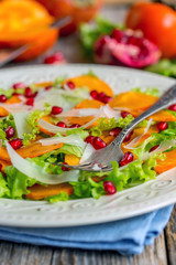 Salad with persimmon and cheese.