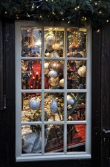 Christmas decorations framed in window on sale at the market in Cologne, Germany