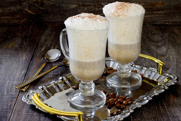 Cappuccino on the wooden table in rustic style