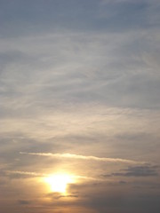 Sunlight raying through cirrus clouds before sunset