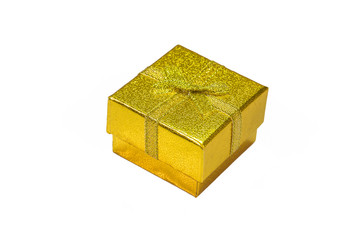 Golden gift box with golden ribbon on white background