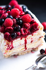 Homemade Pavlova with berry fruits on serving board