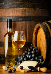 white wine on wooden barrel background
