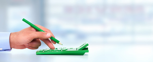 Hand with a calculator.