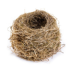 Obraz premium Original empty bird's nest close-up isolated on a white background.