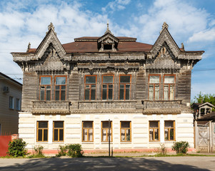 Fototapeta premium Carved window and old National russian wooden house