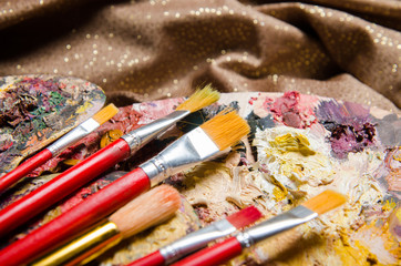 Obraz premium Art concept with palette and brushes