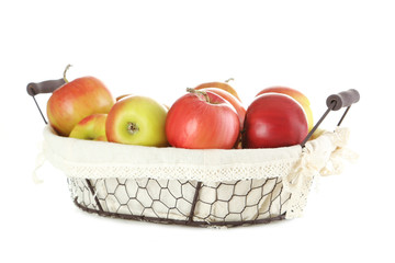 Fresh apples in basket isolated on a white