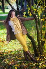 Happy woman enjoying in autumn.