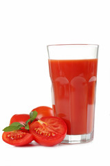 Fresh red tomatoes and tomato juice in glass isolated on white