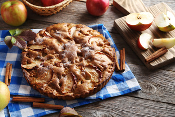 Obraz na płótnie Canvas Homemade apple cake on grey wooden table