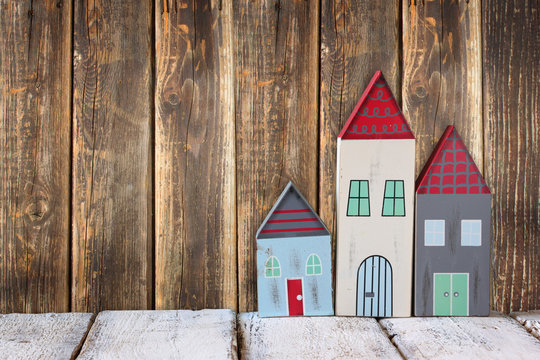 image of vintage wooden colorful houses decoration on wooden table.
