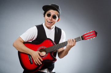 Funny guitar player in musical concept