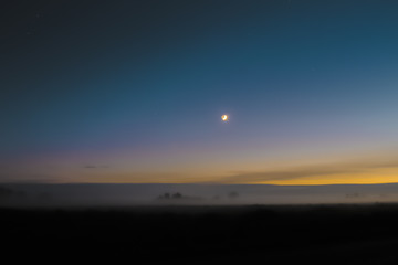 Moon over the field