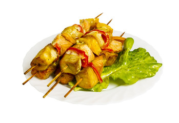 grilled fish with greens on the plate, isolated