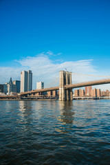 Fototapeta na wymiar Brooklyn bridge in New York on bright summer day