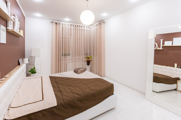 Modern minimalism style bedroom interior in light warm tones