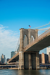 Fototapeta premium Brooklyn bridge in New York on bright summer day