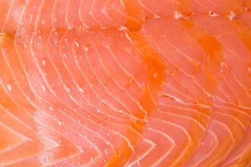 Türaufkleber Macro of some slices of smoked salmon. Perfect as organic background. © mubus