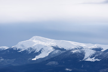 Fototapeta na wymiar Mountain top under snow