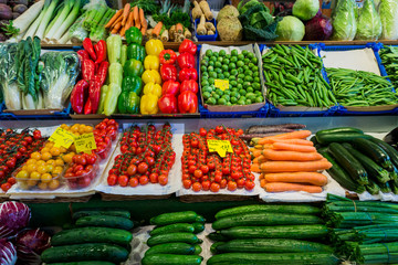 market with various colorful fresh fruits and vegetables. Farmer
