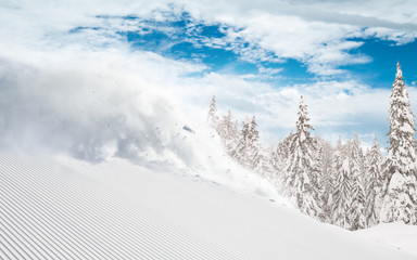 Skier skiing downhill in high mountains