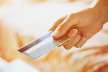 hand holding credit card