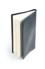 Black leather notebook on white background