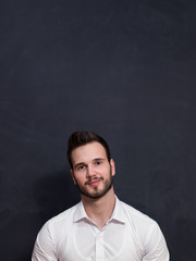 smiling student or teacher at the blackboard