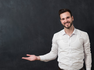smiling student or teacher at the blackboard