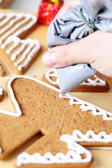 Decorating gingerbread cookies.