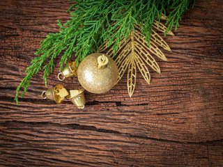 Christmas fir tree with decoration on dark wooden board