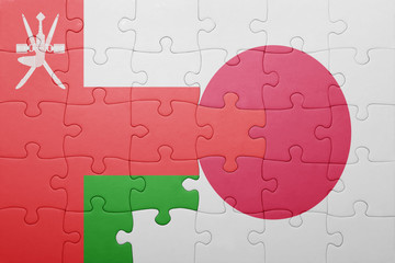 puzzle with the national flag of japan and oman