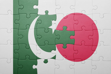 puzzle with the national flag of japan and pakistan