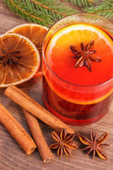 Mulled wine for christmas or winter evening with spices and spruce branches