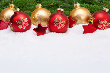 christmas balls with stars on snow background