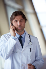doctor speaking on cellphone