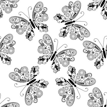 Seamless pattern with black lacy butterflies
