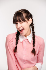 Portrait of a young woman winking