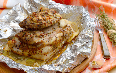 Baked pork on round board.